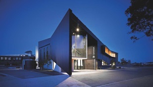 Steel plays a starring role at the entry to each SWIS, were a two-storey-high inverted L-shaped canopy is clad in Stramit Longspan® made from COLORBOND® steel that touches the ground